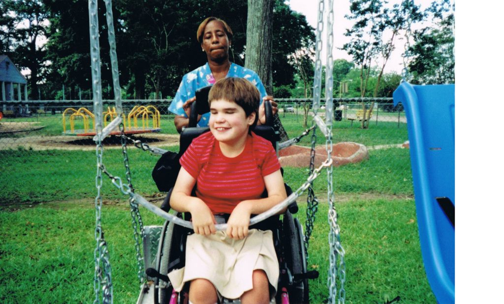 Alison Higginbotham on a wheelchair swing.