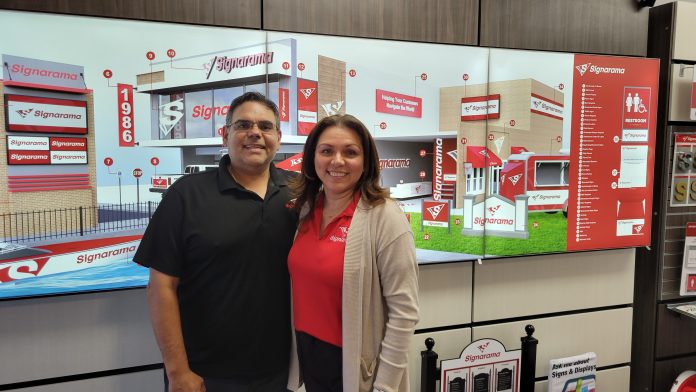 Jose and Cristina Solano with Signarama Broussard