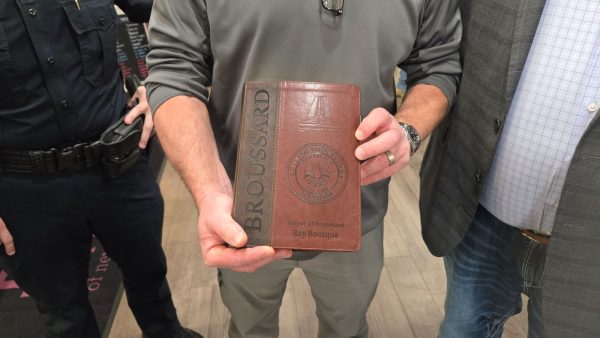 Broussard Mayor Ray Bourque was presented with a custom Bible